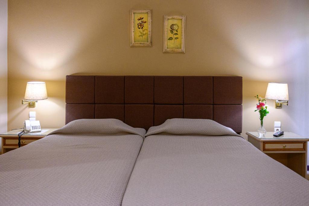 Postel nebo postele na pokoji v ubytování Hotel Vyzantino