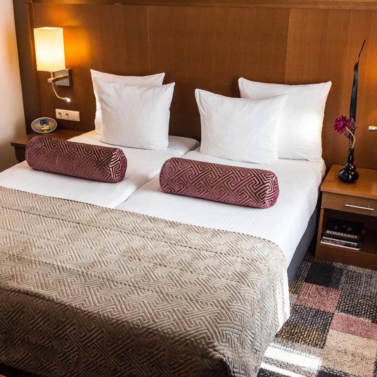 Postel nebo postele na pokoji v ubytování Hotel Amstelzicht