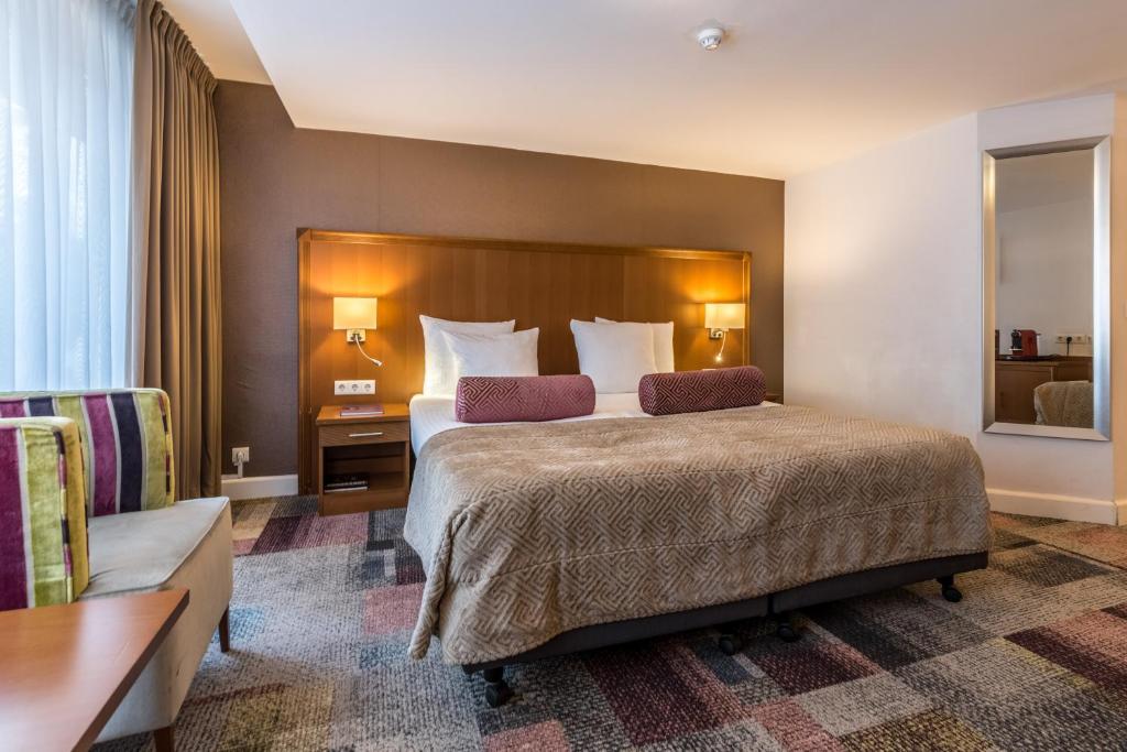 Postel nebo postele na pokoji v ubytování Hotel Amstelzicht