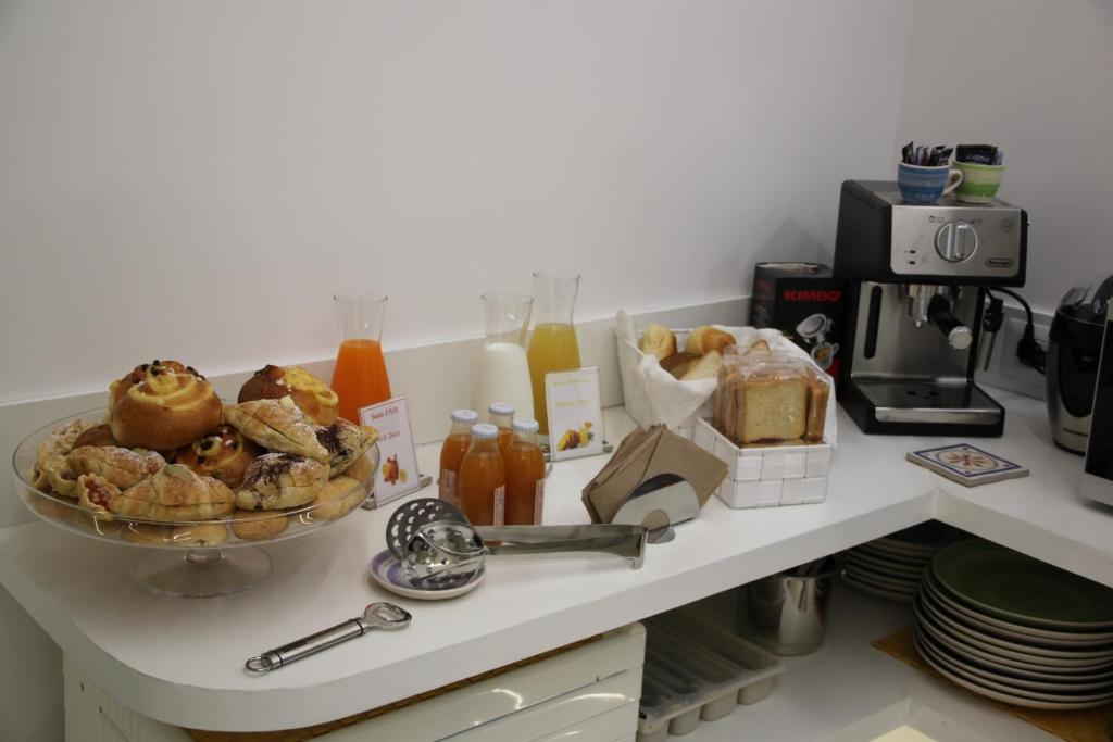 a table with a bowl of food on a counter at BLU SEA SORRENTO in Sorrento
