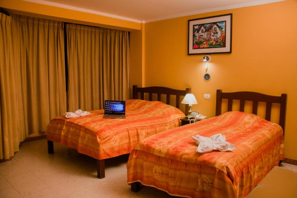 Postel nebo postele na pokoji v ubytování Hotel Amoretto