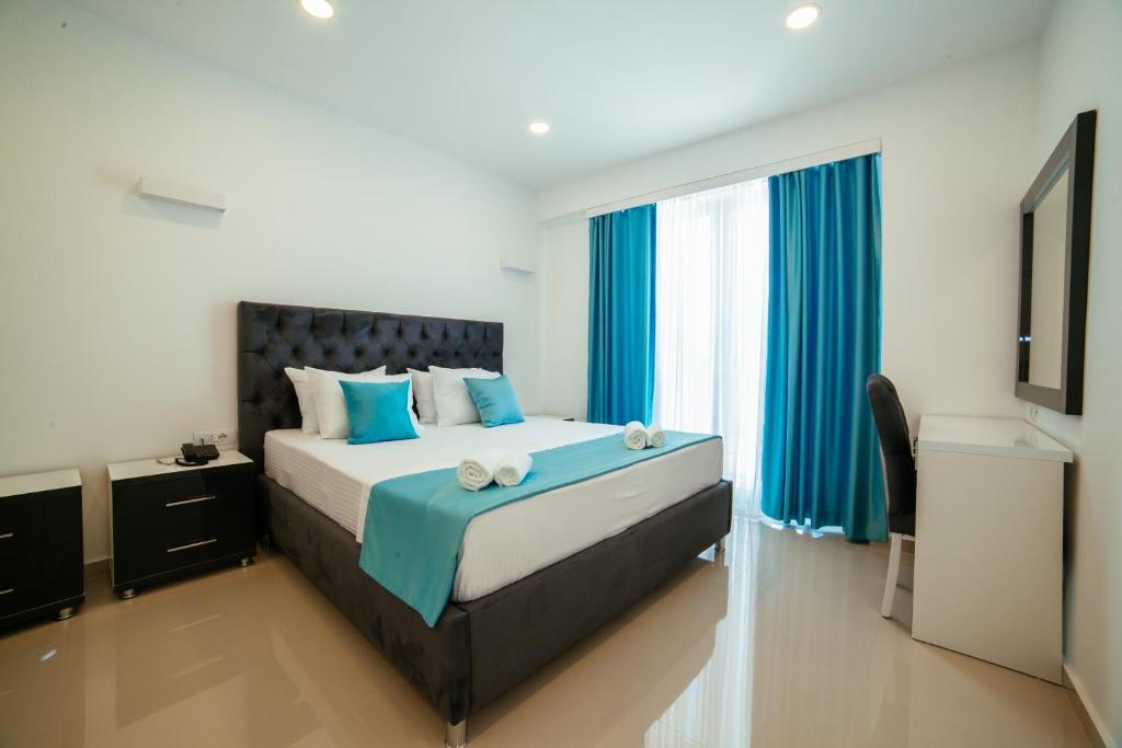Postel nebo postele na pokoji v ubytování Hotel Ambiente Ulcinj