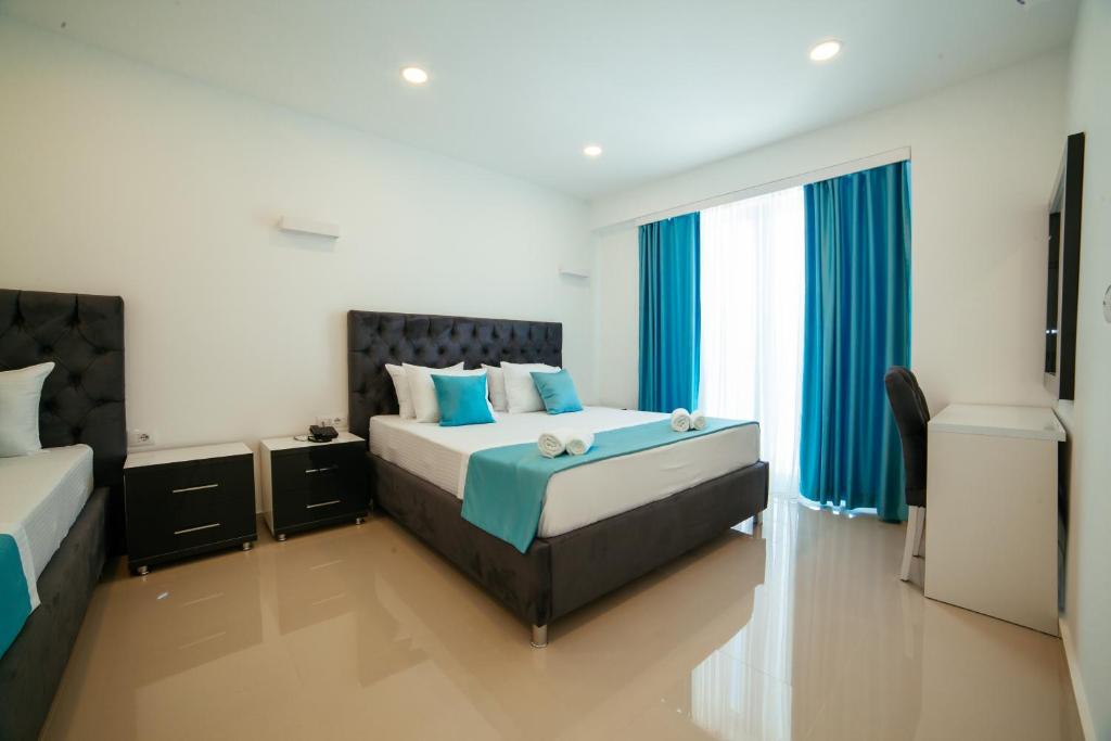 Postel nebo postele na pokoji v ubytování Hotel Ambiente Ulcinj