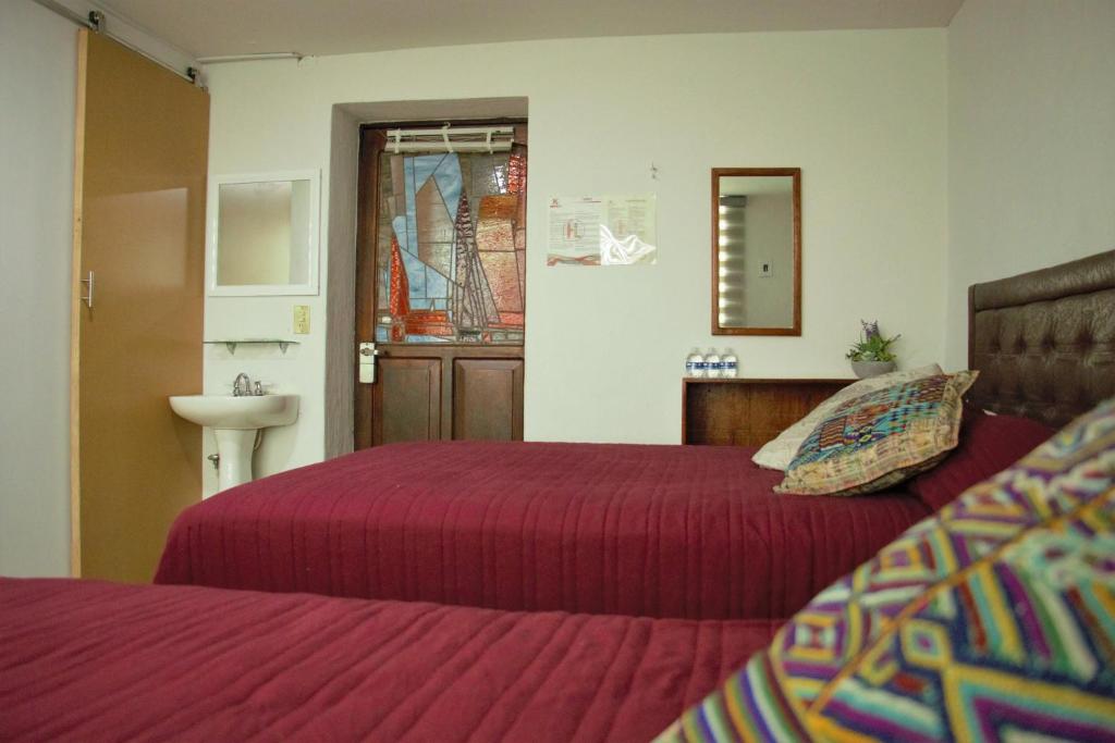 Postel nebo postele na pokoji v ubytování Hotel lit Guadalajara