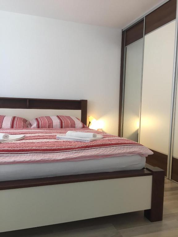 Posteľ alebo postele v izbe v ubytovaní City Centre Apartment Liptovsky Mikulas