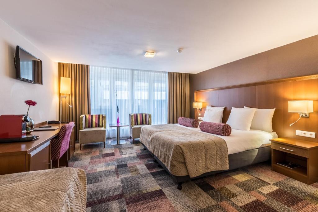 Postel nebo postele na pokoji v ubytování Hotel Amstelzicht