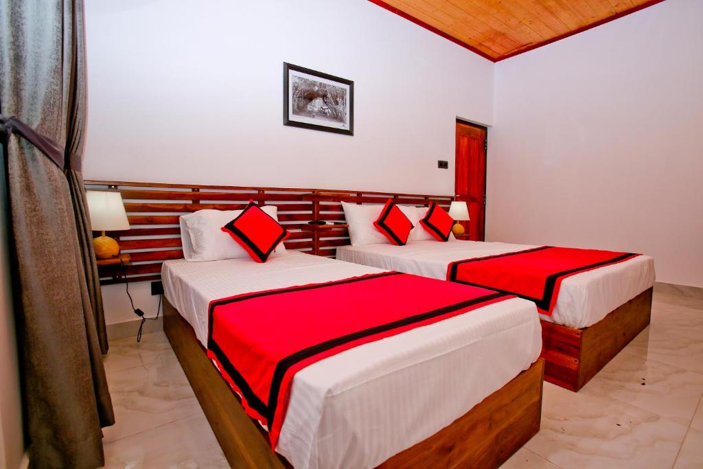 Postel nebo postele na pokoji v ubytování Sapumal Lodge