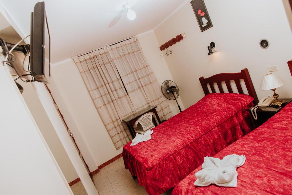 Postel nebo postele na pokoji v ubytování Hotel Amoretto