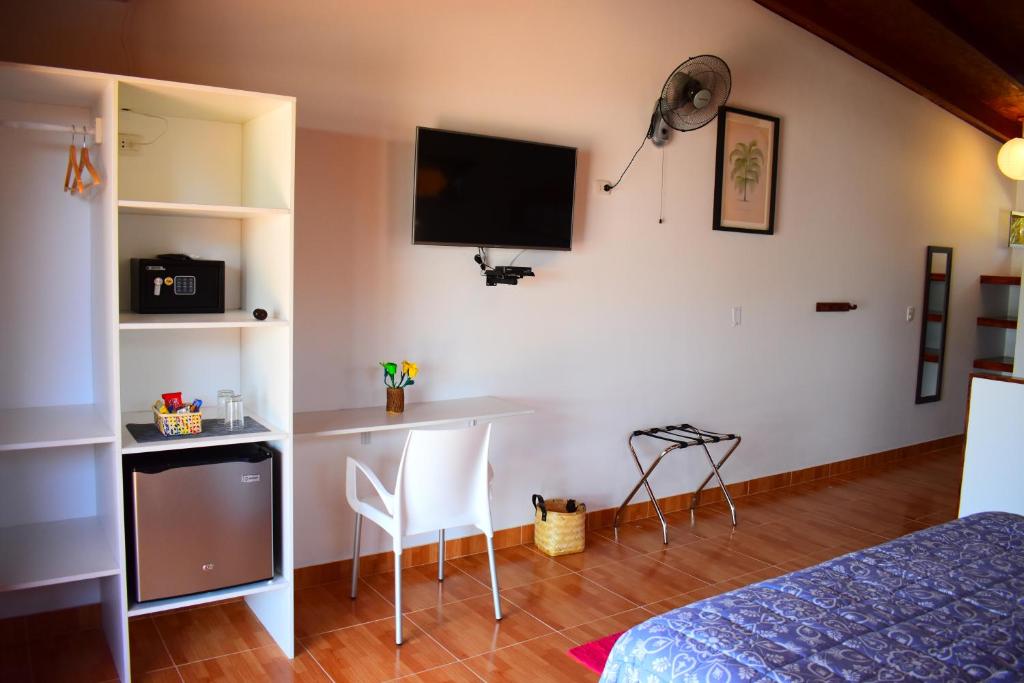 TV a/nebo společenská místnost v ubytování Punta del Norte Bungalows