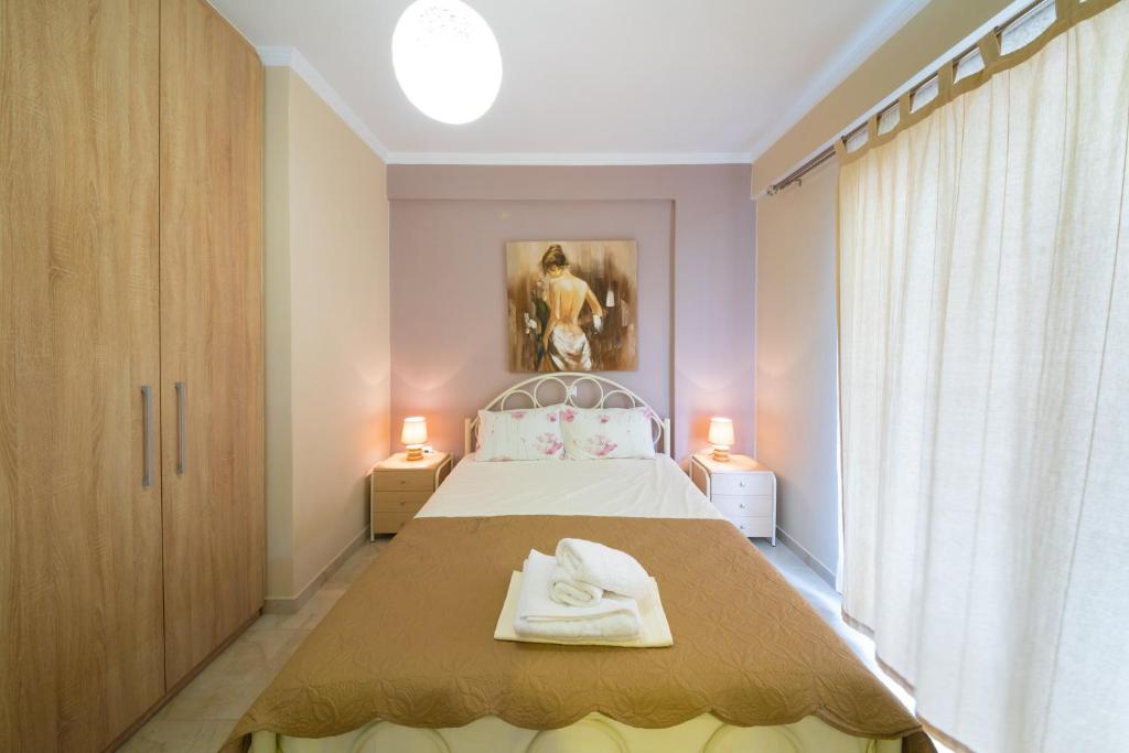 Postel nebo postele na pokoji v ubytování Ionian View Apartments - Parga Panoramic Seaview Gems