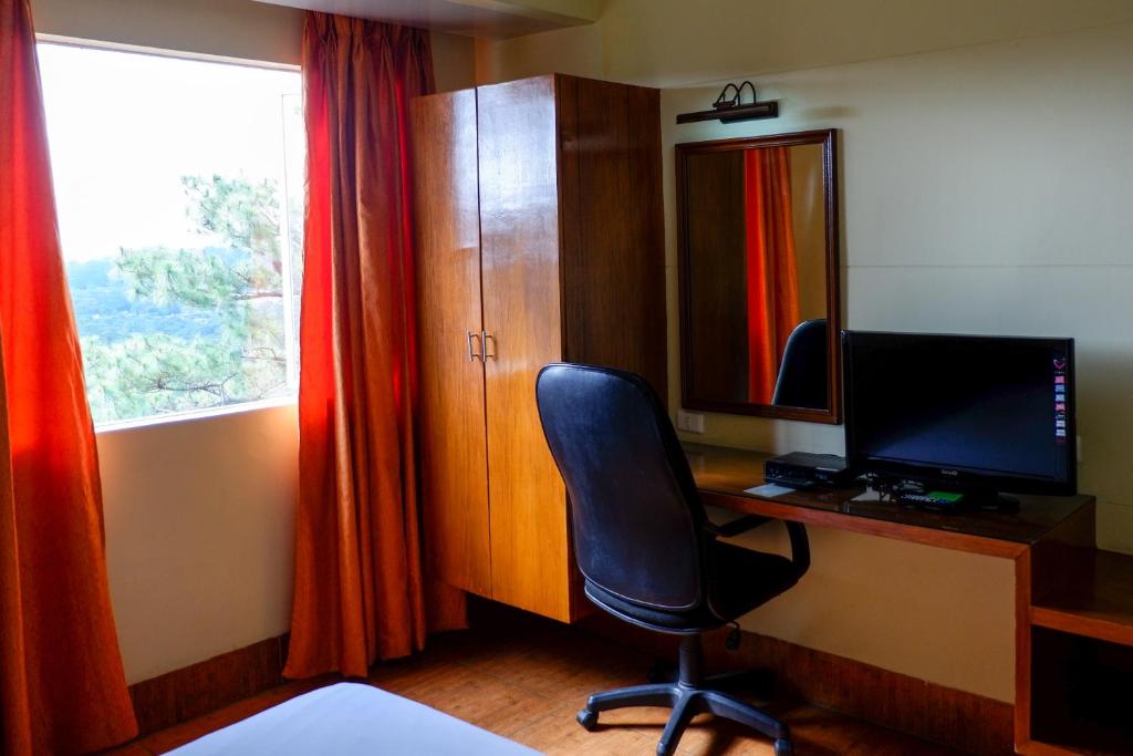 TV a/nebo společenská místnost v ubytování Albergo Hotel