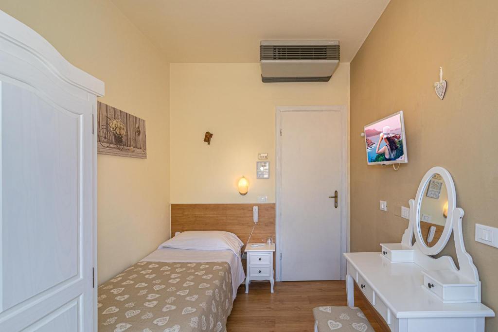 Postel nebo postele na pokoji v ubytování Hotel Mariani