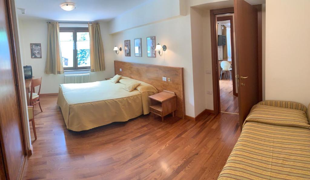 A bed or beds in a room at R.T.A. Hotel Monte Rosa
