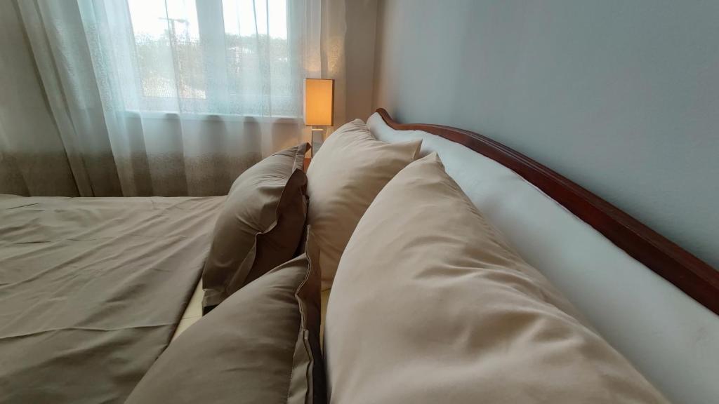 Postel nebo postele na pokoji v ubytování ICity