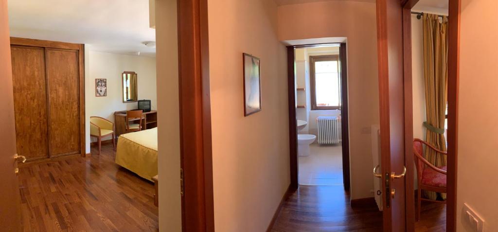 A bed or beds in a room at R.T.A. Hotel Monte Rosa