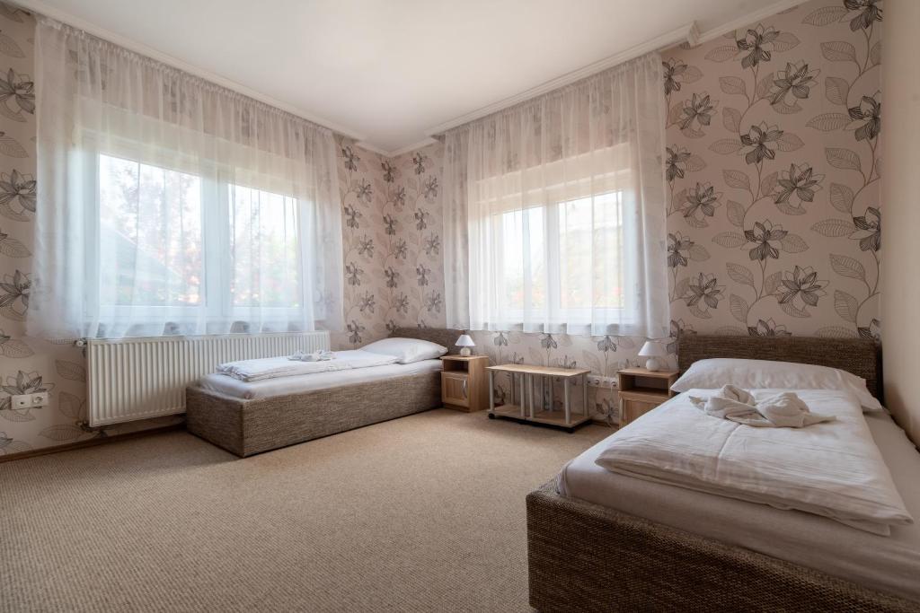 Posteľ alebo postele v izbe v ubytovaní Villa Topáz
