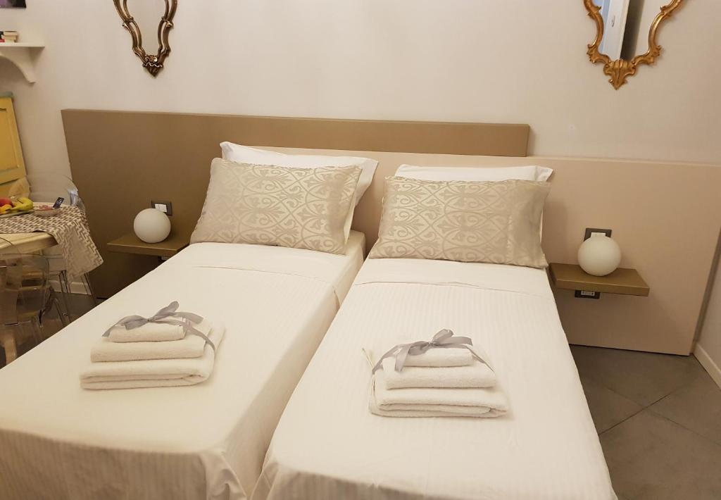 Postelja oz. postelje v sobi nastanitve Il Sogno Torino Guesthouse