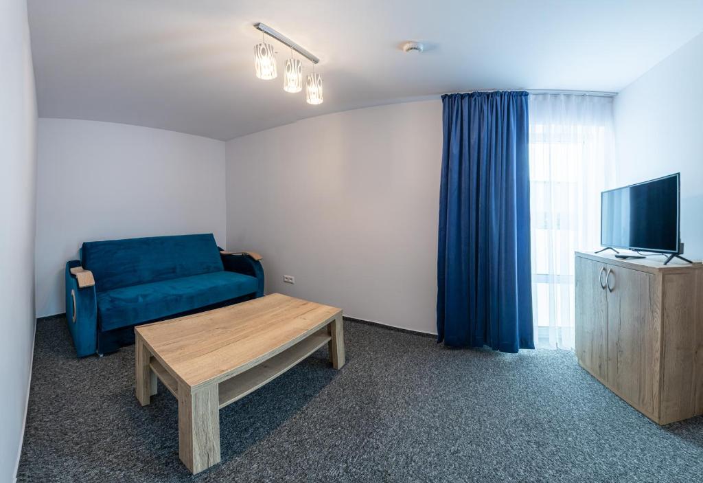 TV a/nebo společenská místnost v ubytování Hotel Prístav