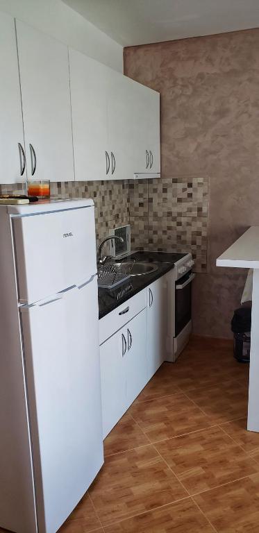 Kuchyň nebo kuchyňský kout v ubytování Oassis