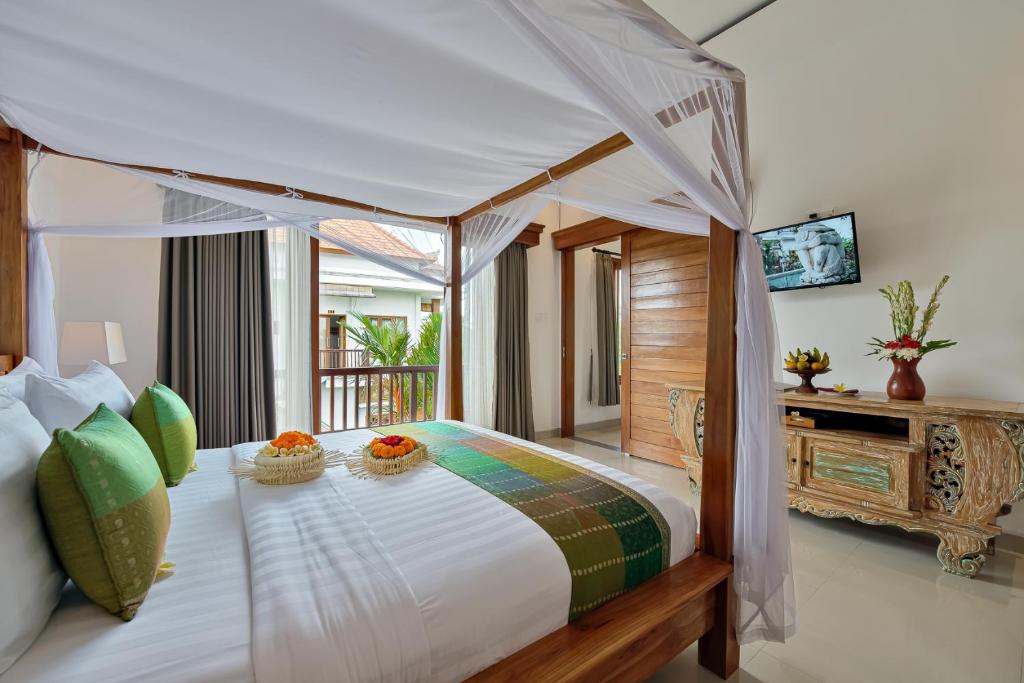 Postel nebo postele na pokoji v ubytování Cenik Villa Ubud