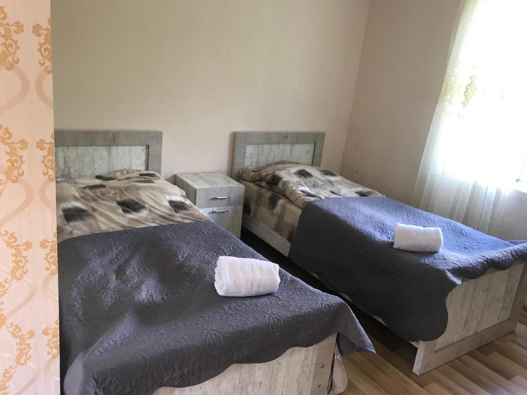 Postel nebo postele na pokoji v ubytování Maxvshi