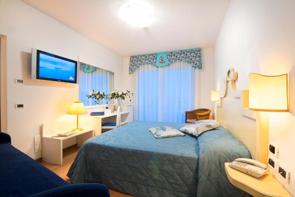 A bed or beds in a room at Hotel Panoramic