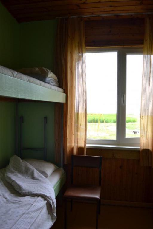 Postel nebo postele na pokoji v ubytování Rannakodu