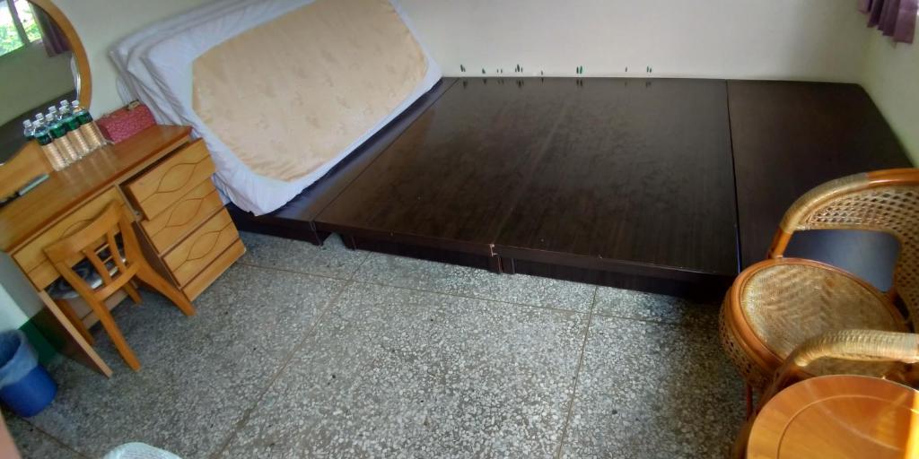 Postel nebo postele na pokoji v ubytování Sun Wu Homestay