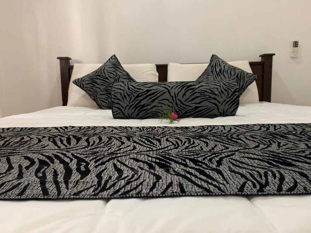 Postel nebo postele na pokoji v ubytování Shan Home Stay Sigiriya