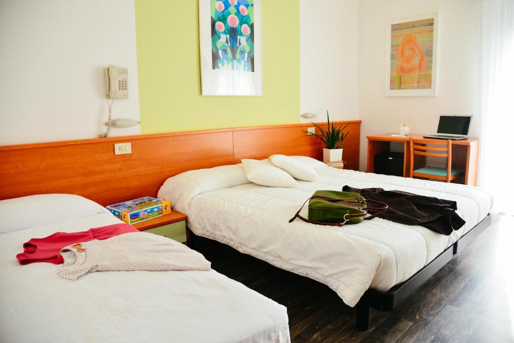 Postel nebo postele na pokoji v ubytování Hotel Domingo