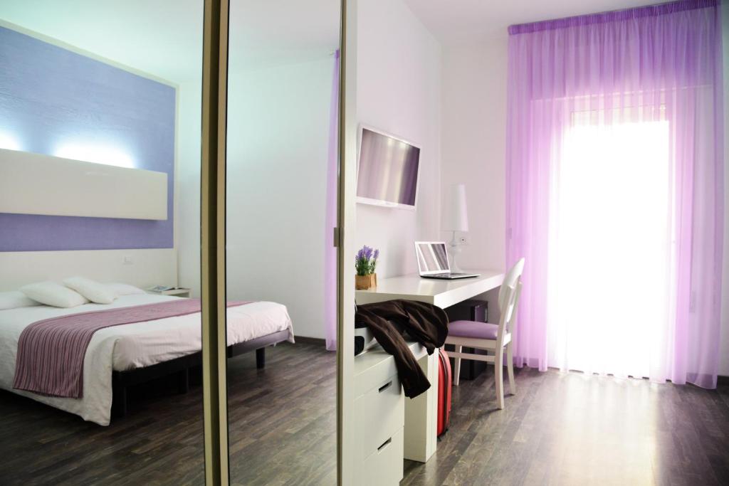 Postel nebo postele na pokoji v ubytování Hotel Domingo