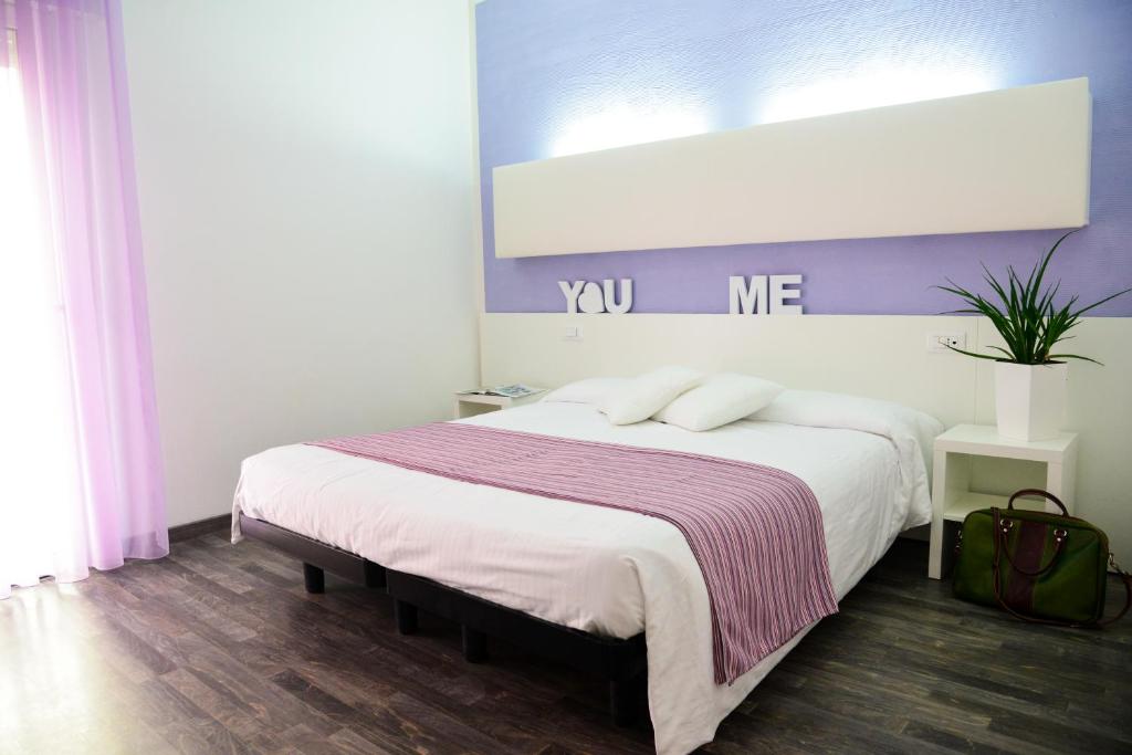 Postel nebo postele na pokoji v ubytování Hotel Domingo