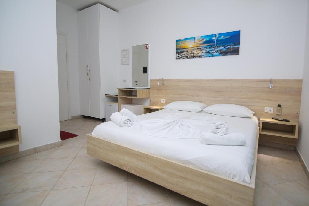 Postel nebo postele na pokoji v ubytování Hotel Jon