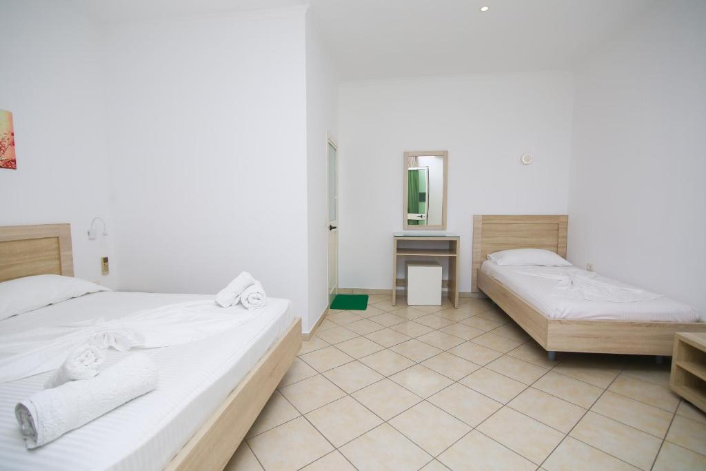 Postel nebo postele na pokoji v ubytování Hotel Jon