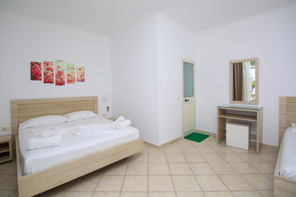 Postel nebo postele na pokoji v ubytování Hotel Jon