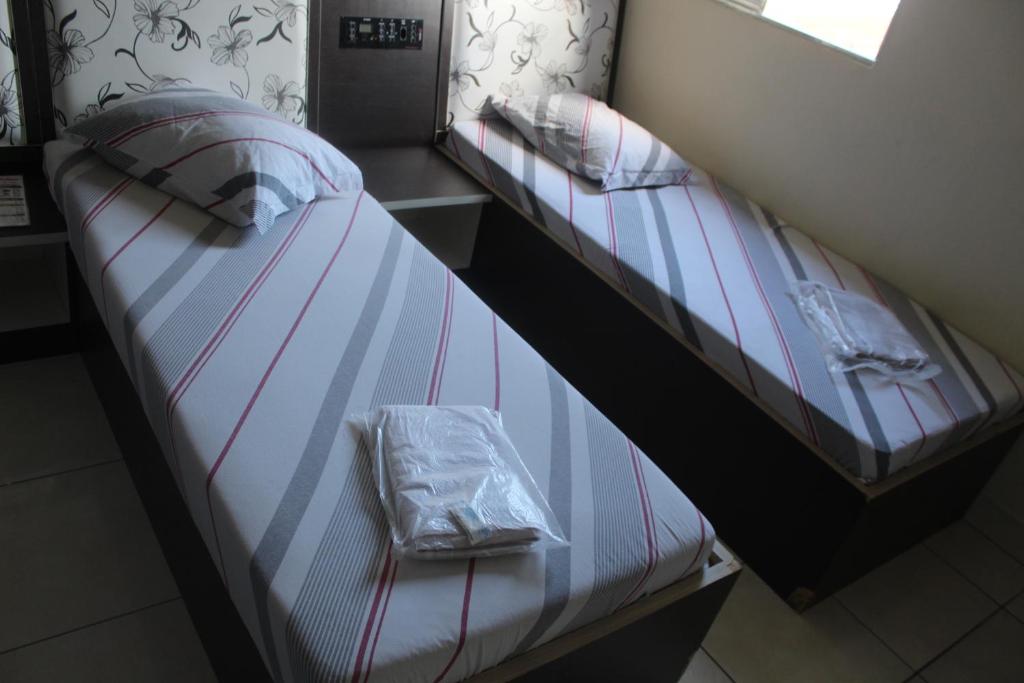 Postel nebo postele na pokoji v ubytování Hotel Cumbica Guarulhos