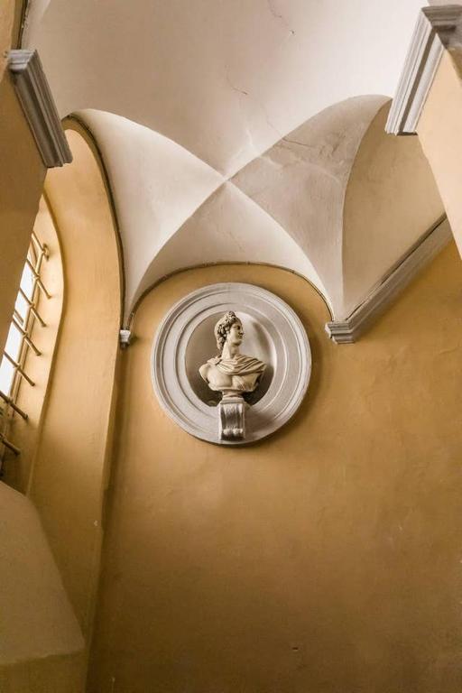 a wall with a picture of a woman on a wall at Royal Piazza di Spagna in Rome
