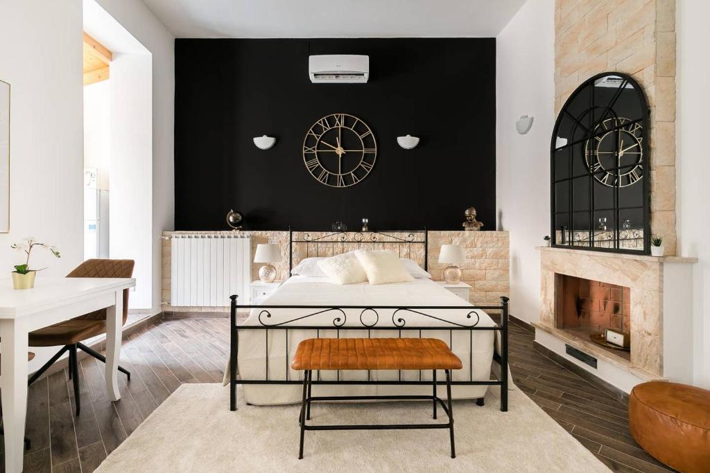 a bedroom with a bed and a fireplace at Royal Piazza di Spagna in Rome