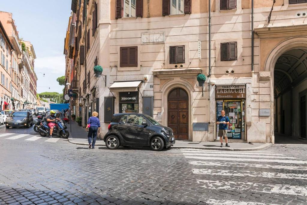 a car parked on the side of a city street at Royal Piazza di Spagna in Rome