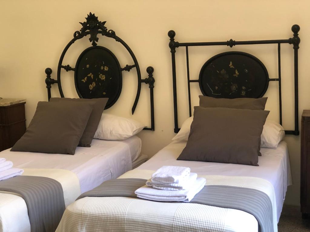 Łóżko lub łóżka w pokoju w obiekcie Central House Terracina