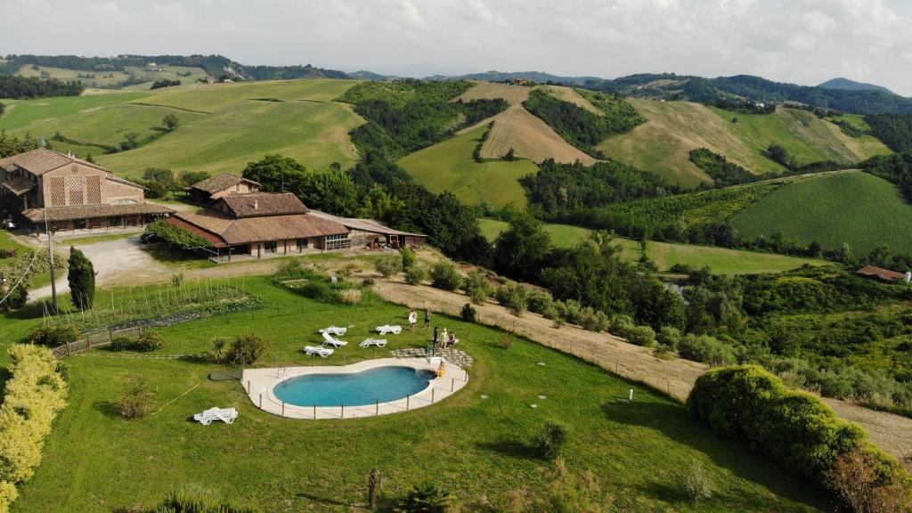 an aerial view of a estate with a pool in a field at Agriturismo Il Tondino in Tabiano