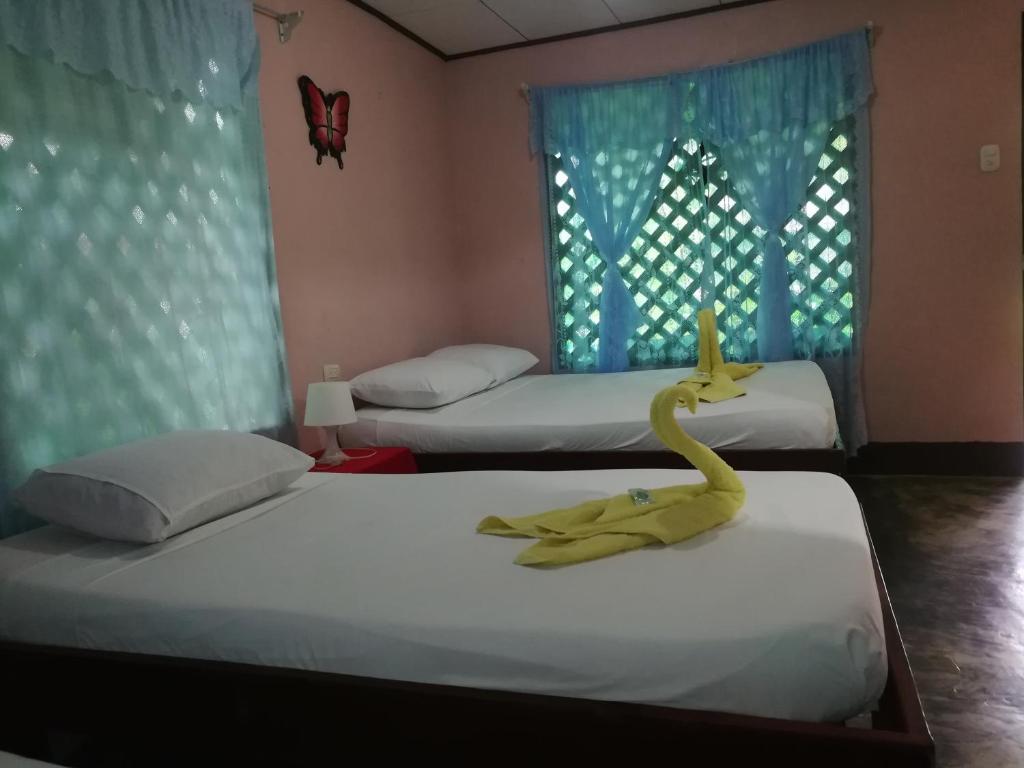Postel nebo postele na pokoji v ubytování Chinitas Eco Lodge