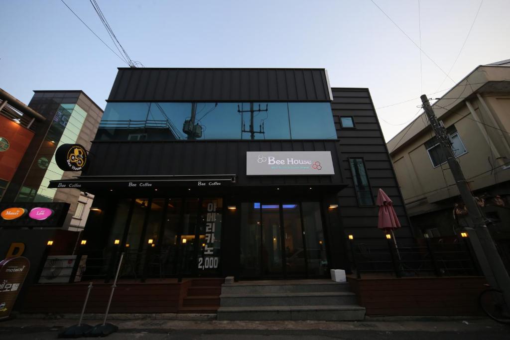 a building with a sign that reads the house at Gyeongju Bee House in Gyeongju