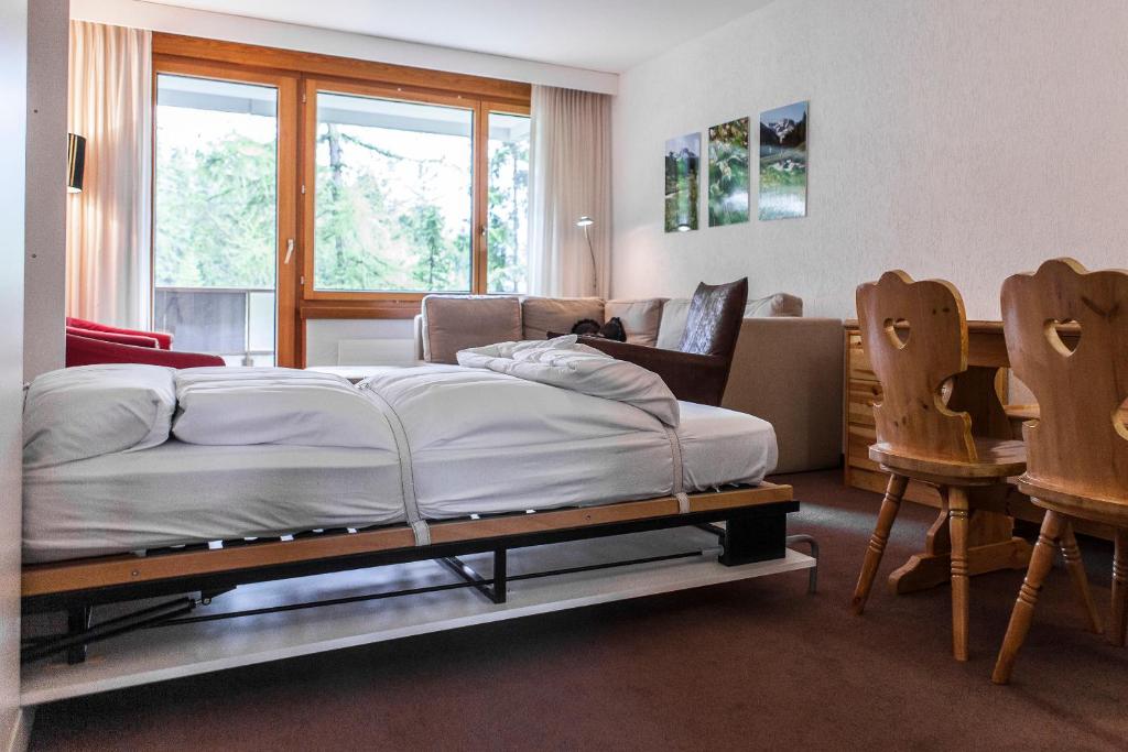 Postel nebo postele na pokoji v ubytování Residenz Alpina im Kurhaus