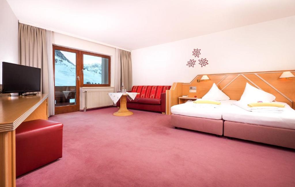 Postel nebo postele na pokoji v ubytování Sporthotel Kühtai