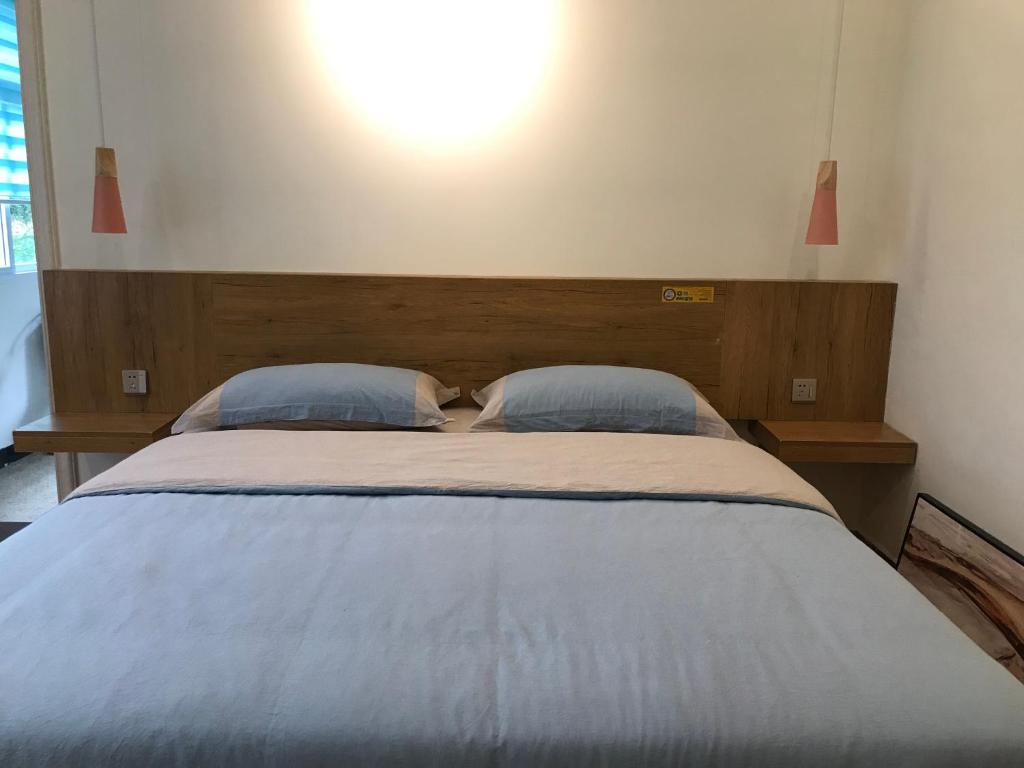 Postel nebo postele na pokoji v ubytování Enshi Grand Canyon Chunlun Farmstay