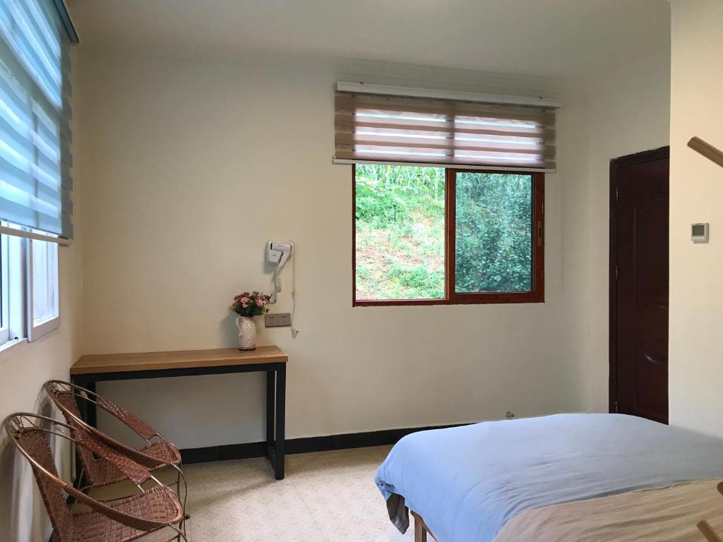 Postel nebo postele na pokoji v ubytování Enshi Grand Canyon Chunlun Farmstay