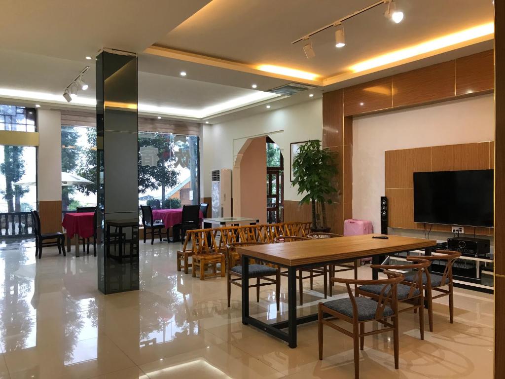 TV a/nebo společenská místnost v ubytování Enshi Grand Canyon Chunlun Farmstay