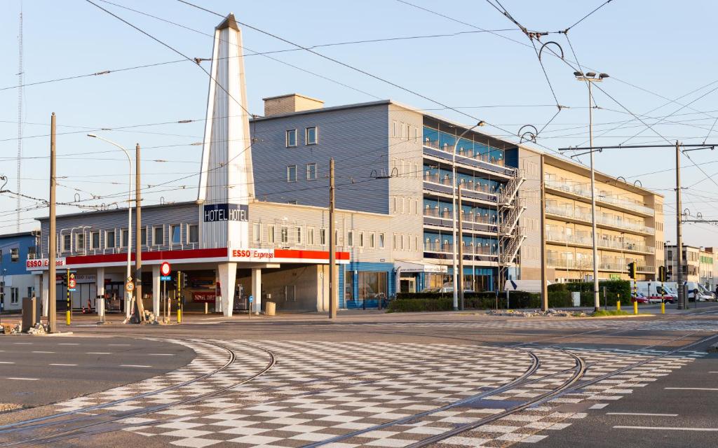 an empty street in front of a large building at Antwerp Harbour Hotel in Antwerp