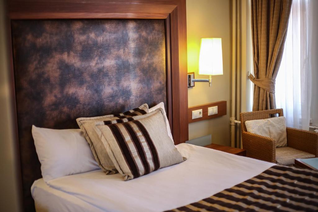 Postel nebo postele na pokoji v ubytování Grand Terme Hotel